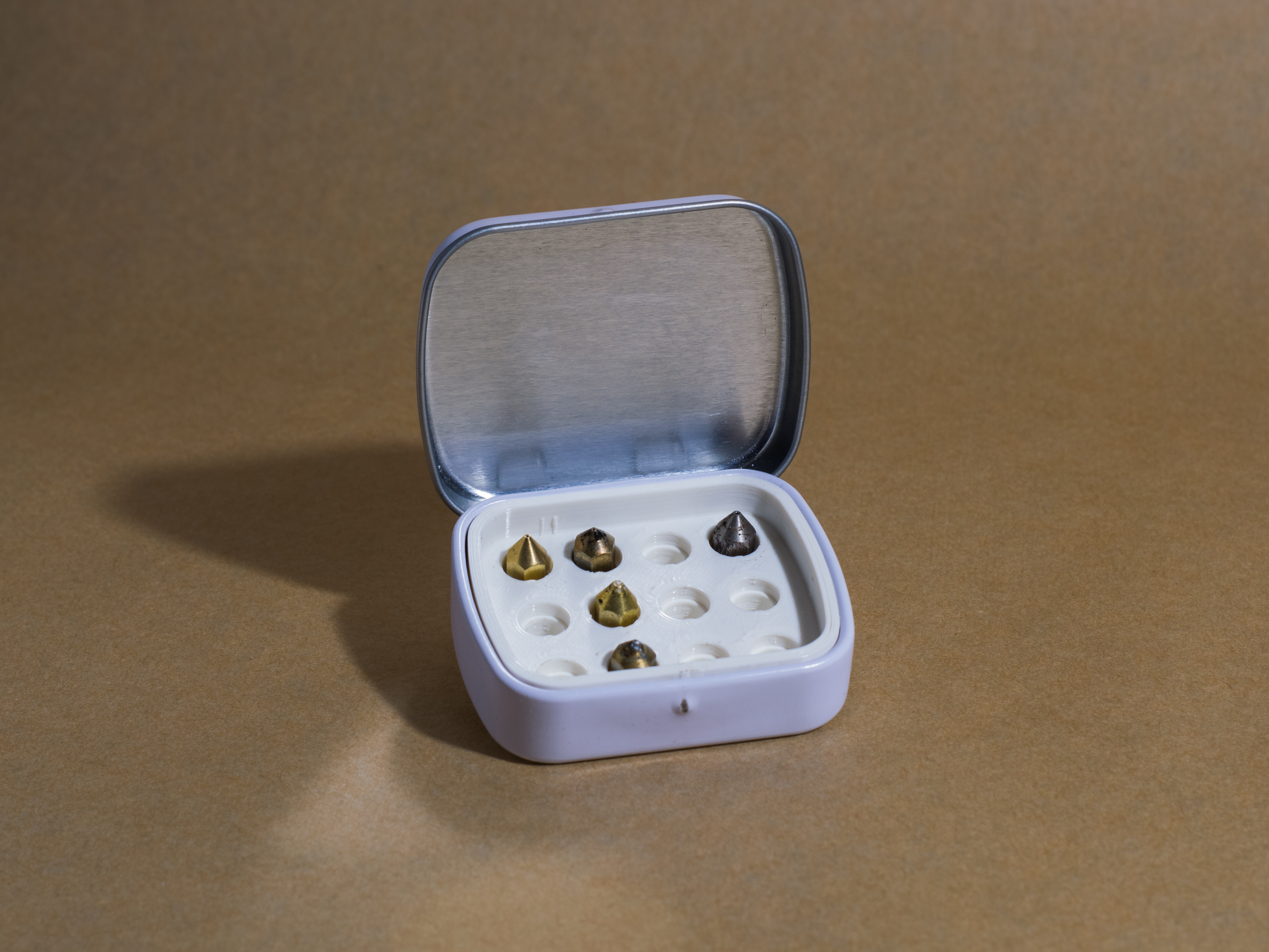 Mint box nozzle storage insert
