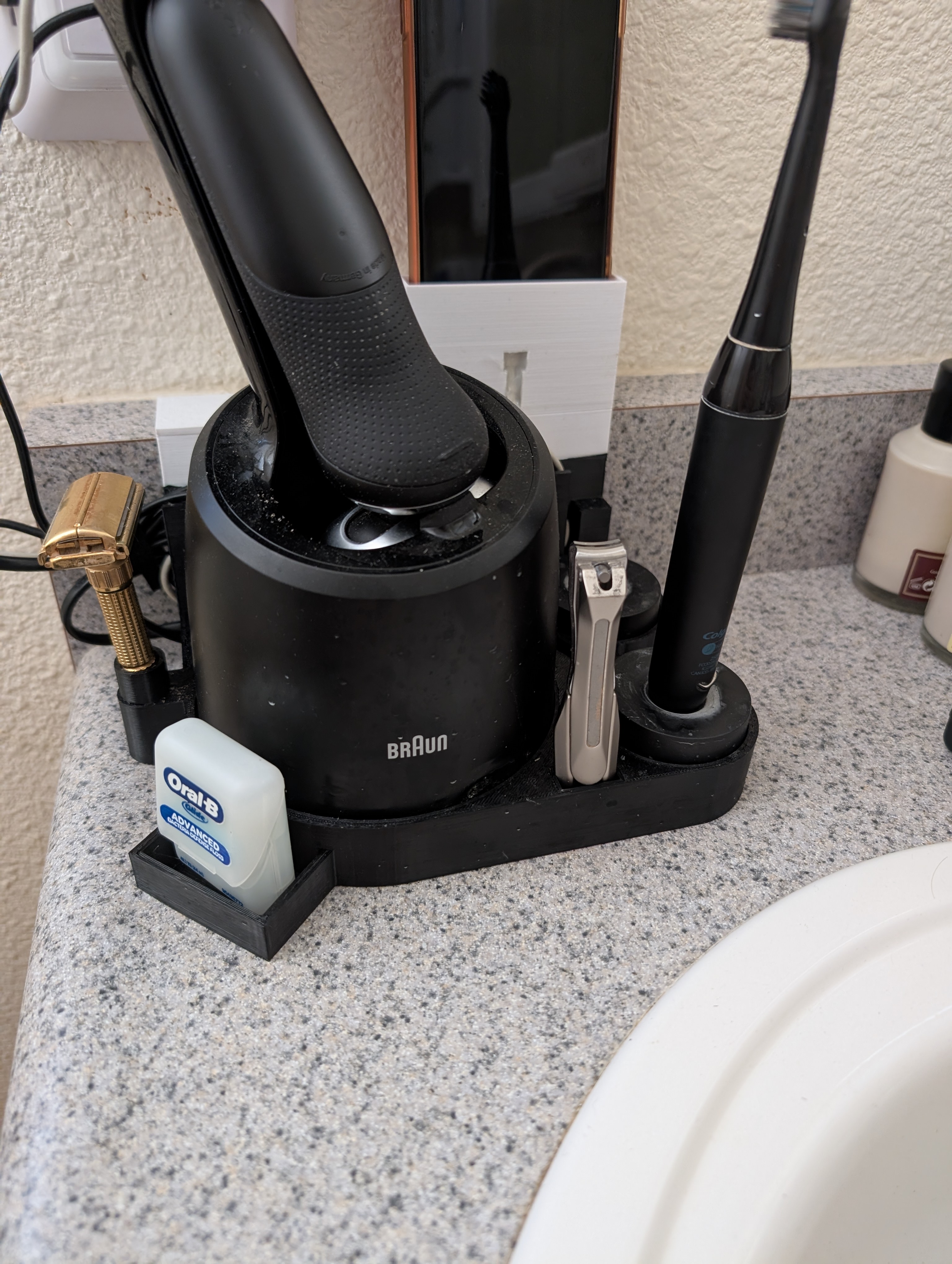 Braun Electric Razor and Colgate electric toothbrush holder