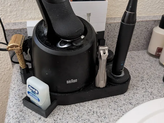 Braun Electric Razor and Colgate electric toothbrush holder
