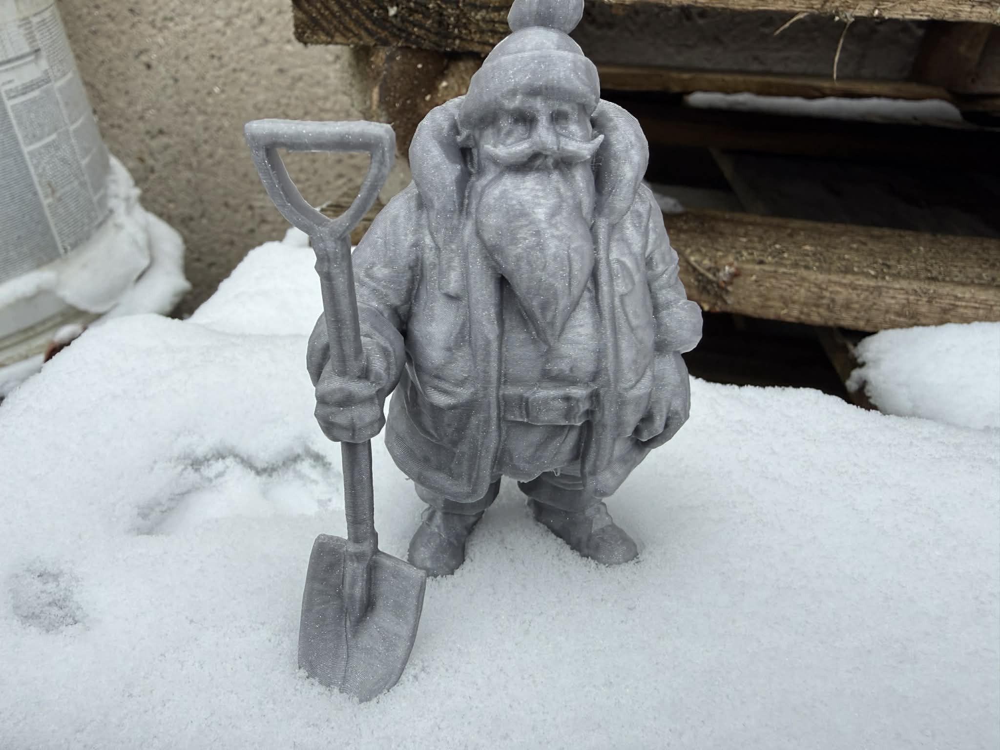Santa Claus with a snow shovel