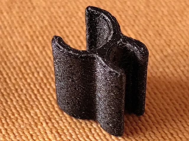 Clip for a jack adapter and headphone cable