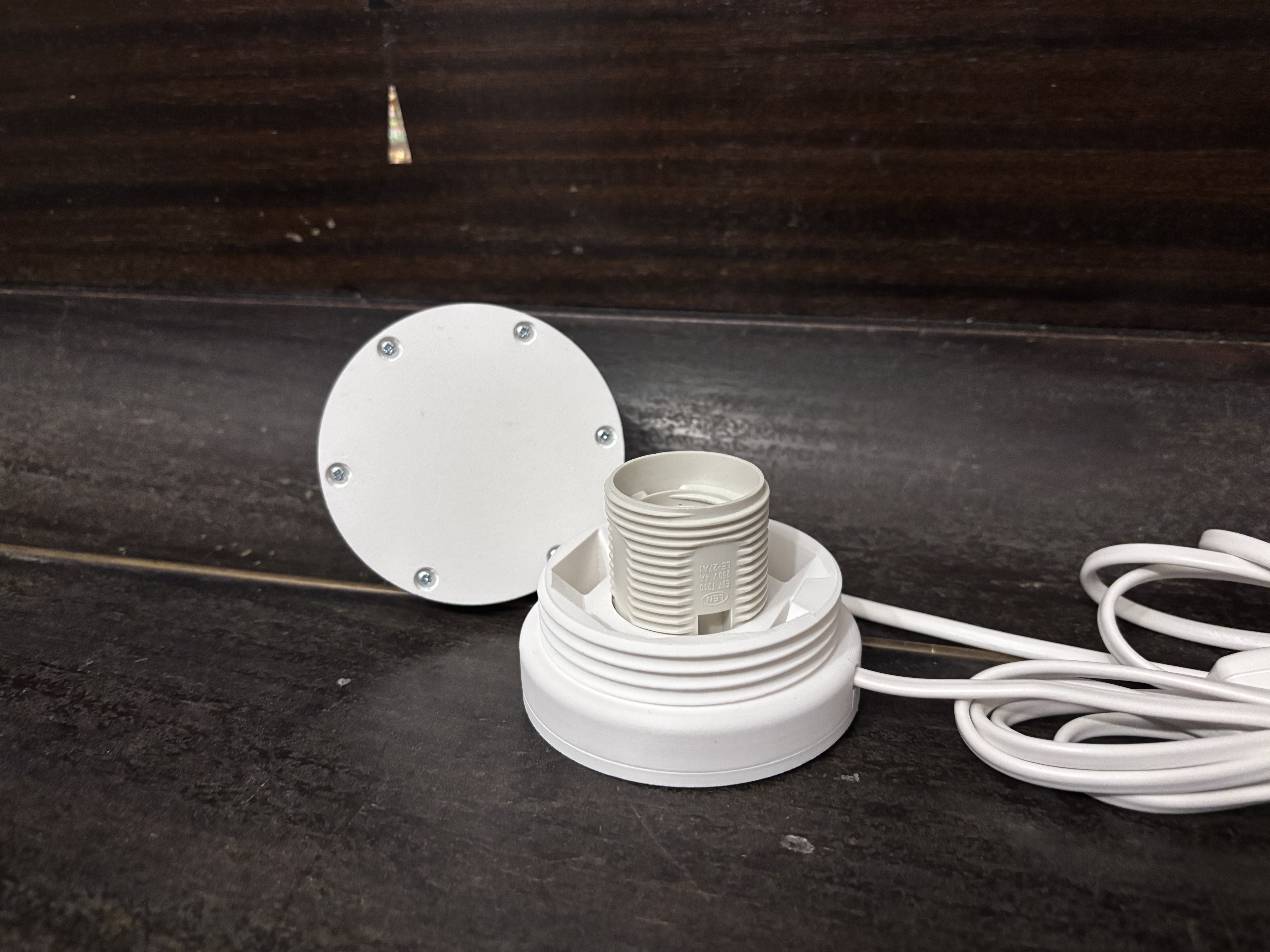 E27 puck base with self-tapping screws
