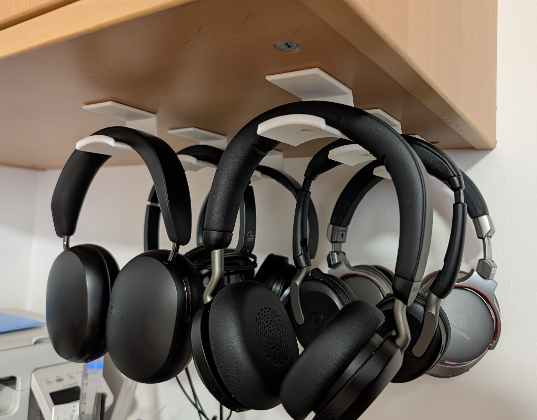 Underside headphones holder