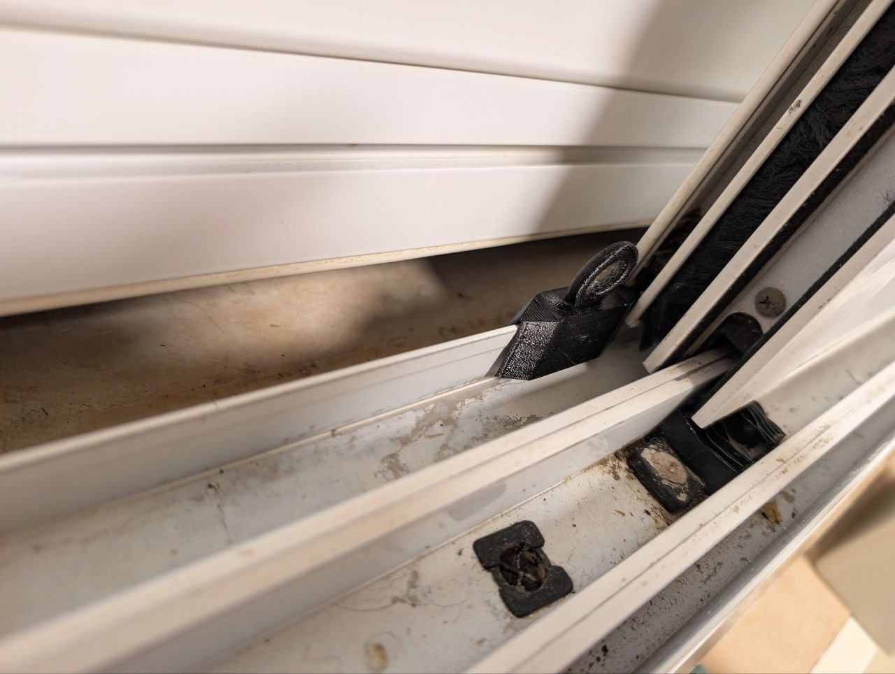 Window screen stopper - to prevent cats from entering the house