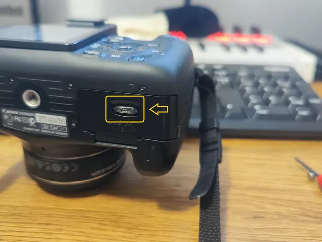 Tab / Spring for battery lid of Canon EOS Rebel T3