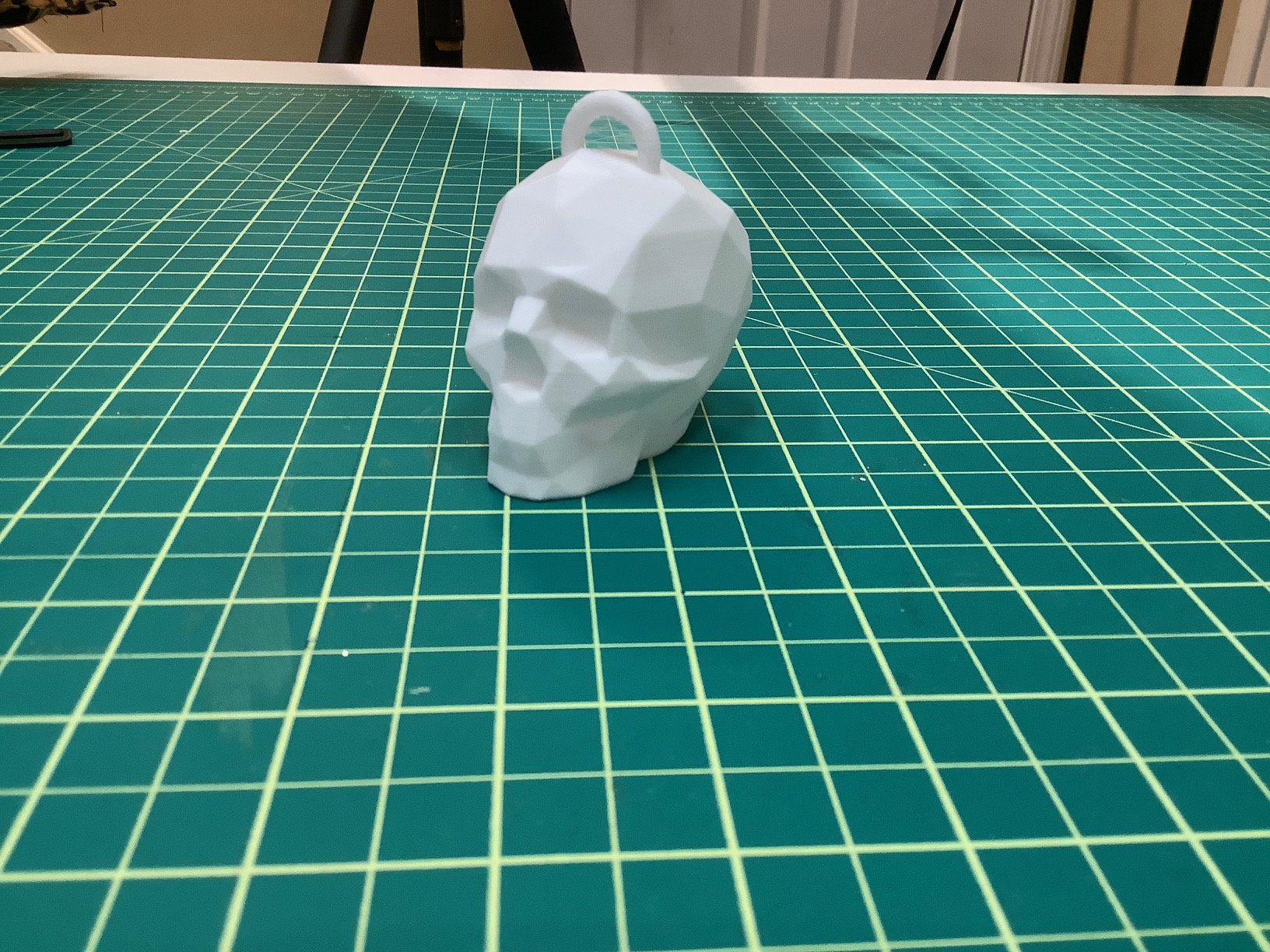 Low poly skull with hanging loop