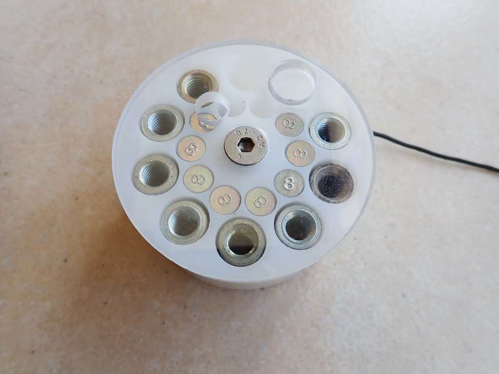 caving spit wall peg dispenser