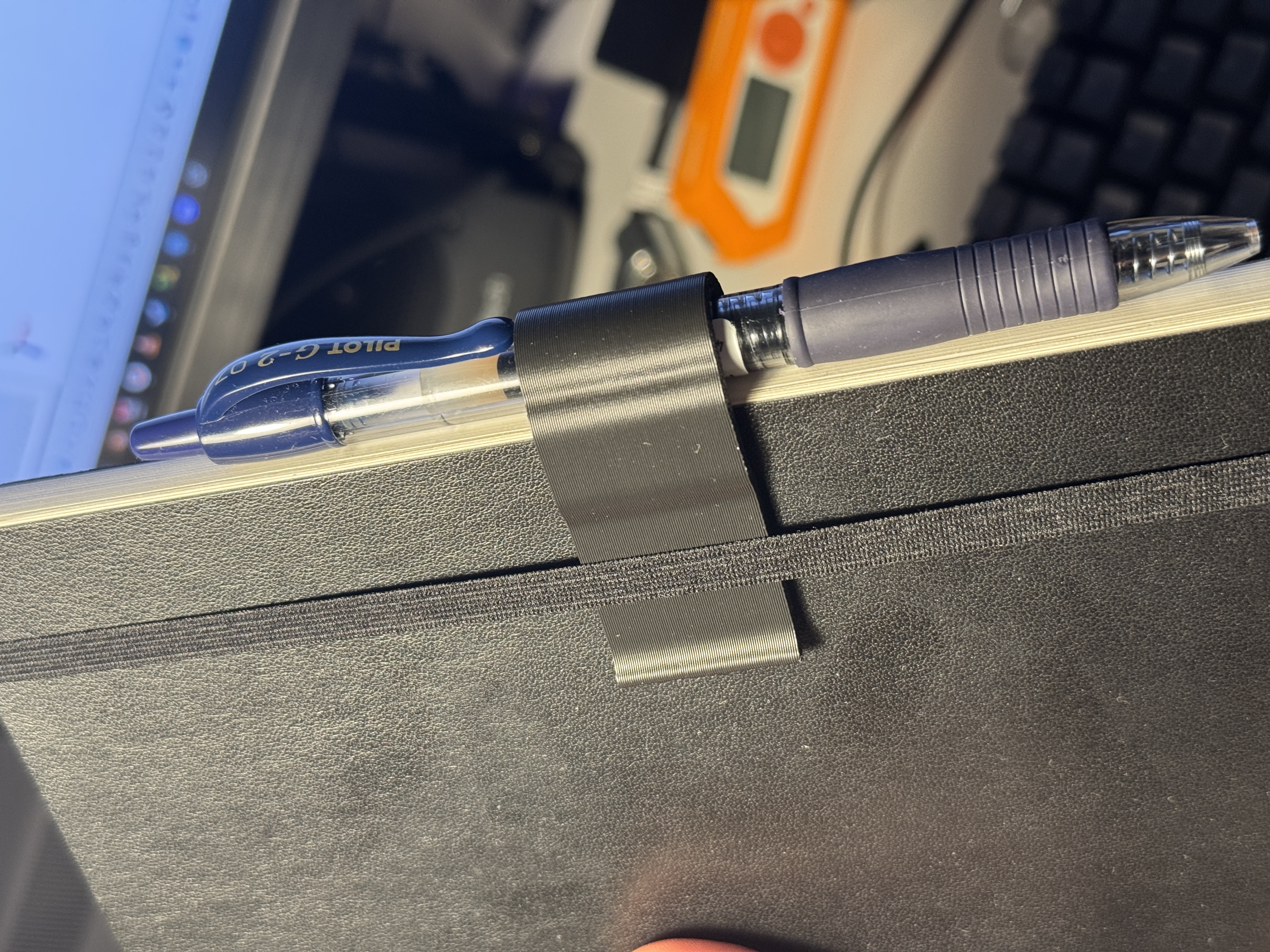 Notebook pen holder
