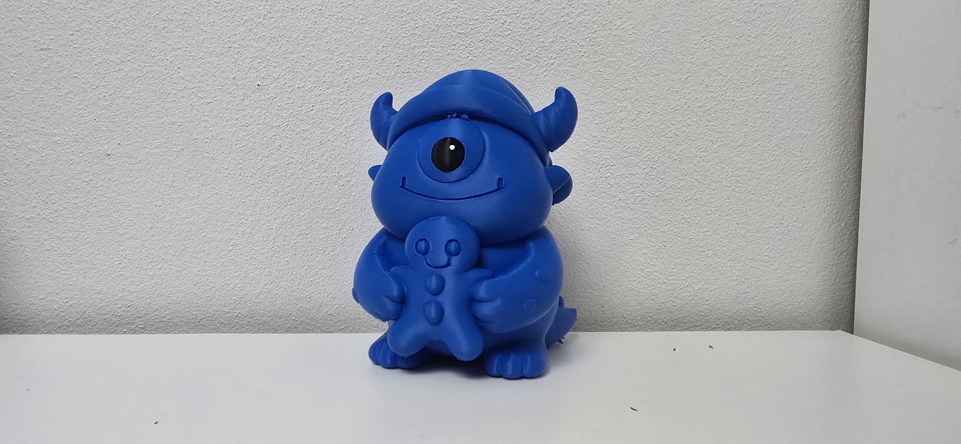 Cute Cyclops Hugging Gingerbread Figure