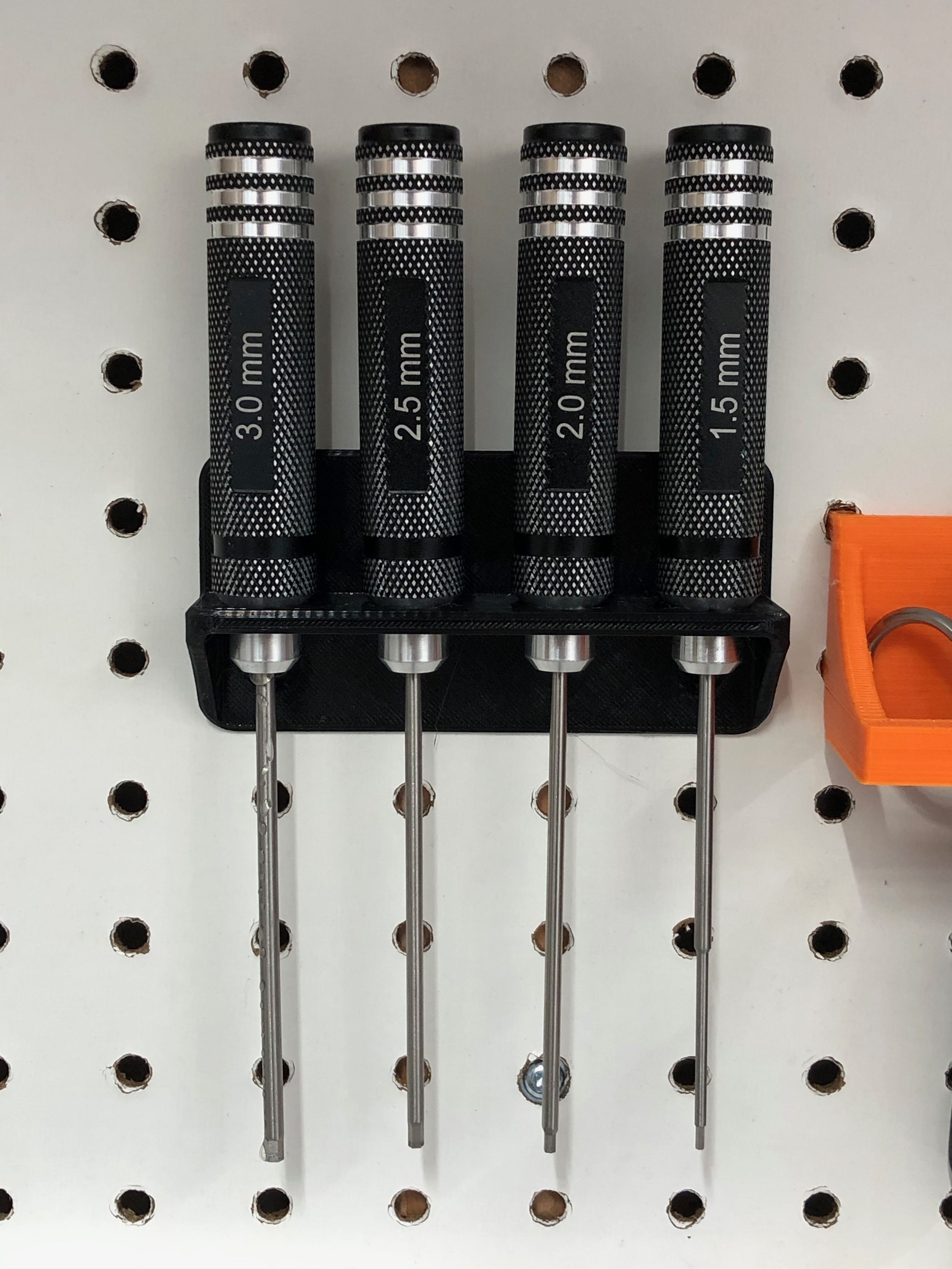 Hex driver holder for pegboard rivets