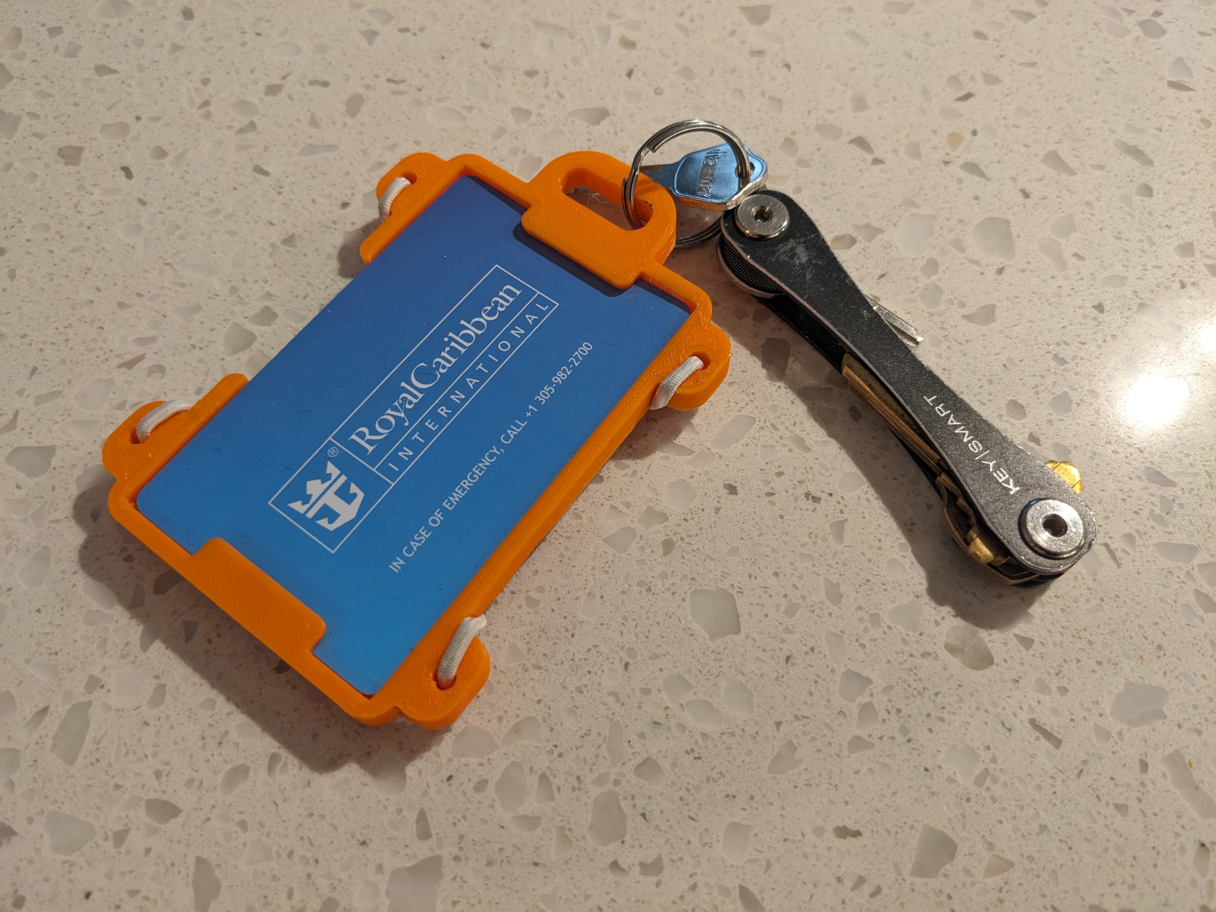 Badge holder with keyring/lanyard hole and holes for elastic