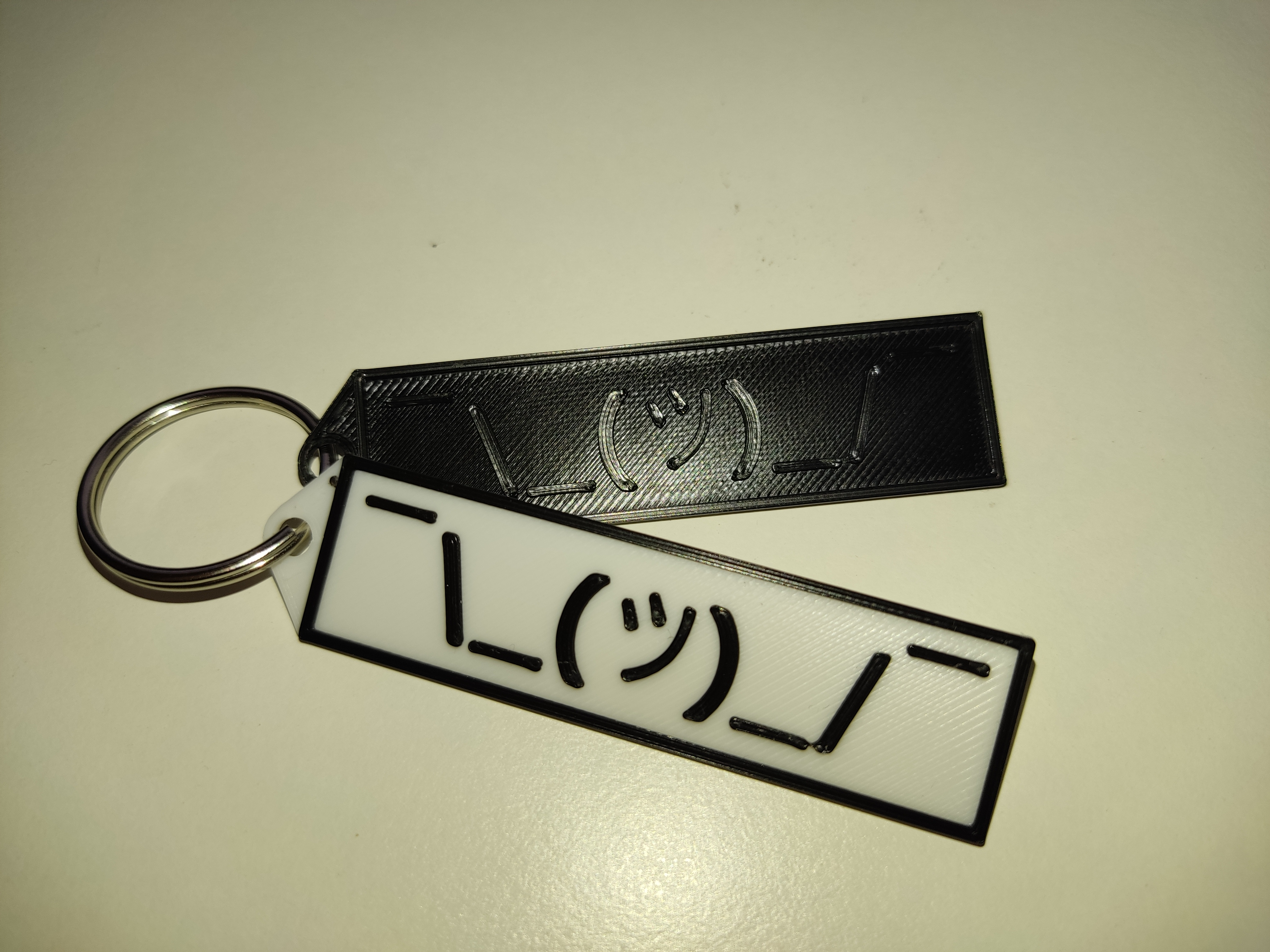 Shrugging keychain