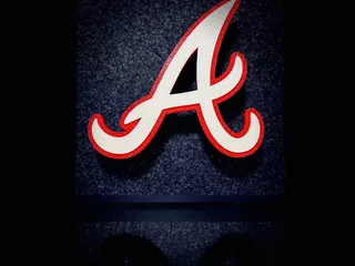 Download Atlanta Braves Logo On A Red And Blue Background