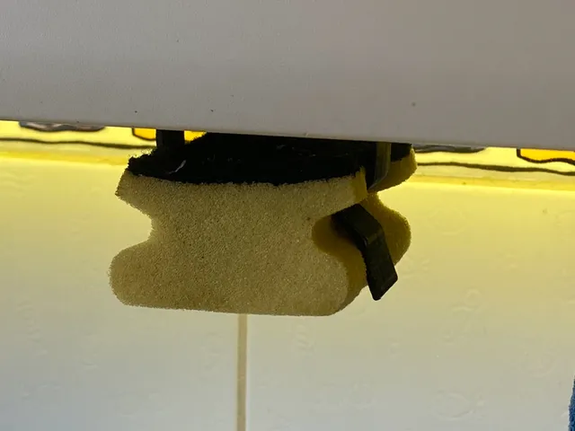 Under cabinet sponge holder