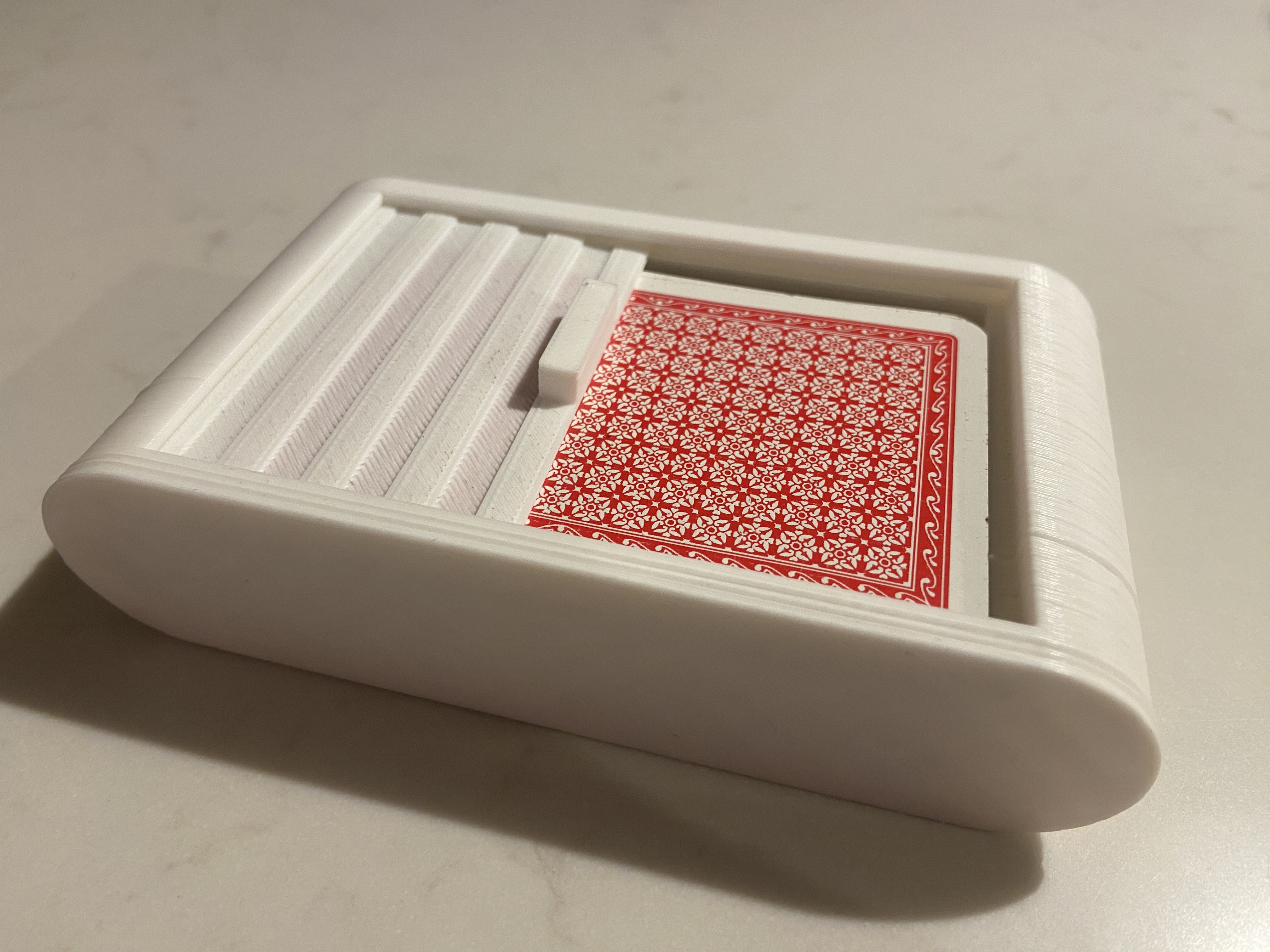 Playing card box with sliding lid
