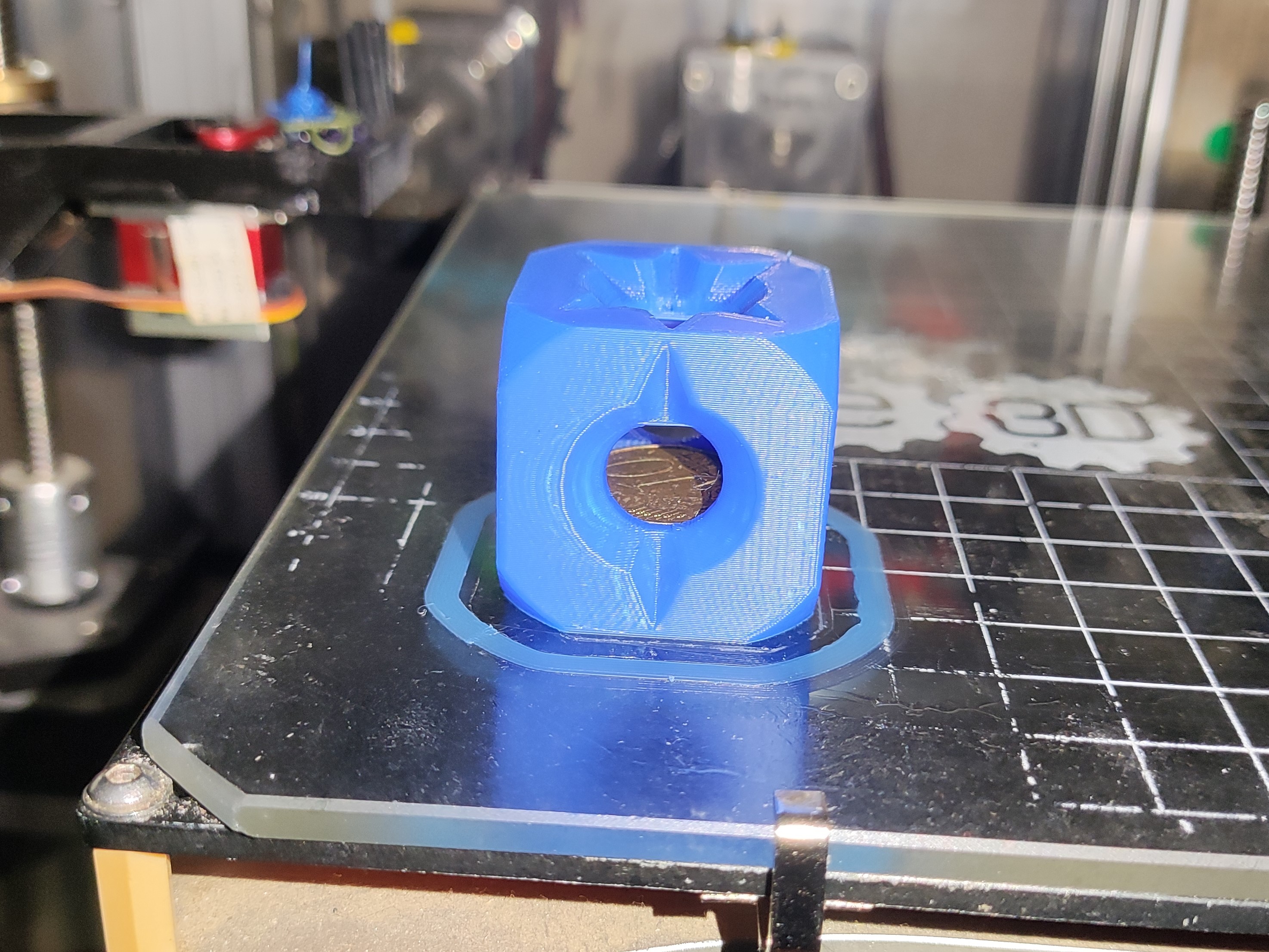 A coin stuck in a cube - No supports
