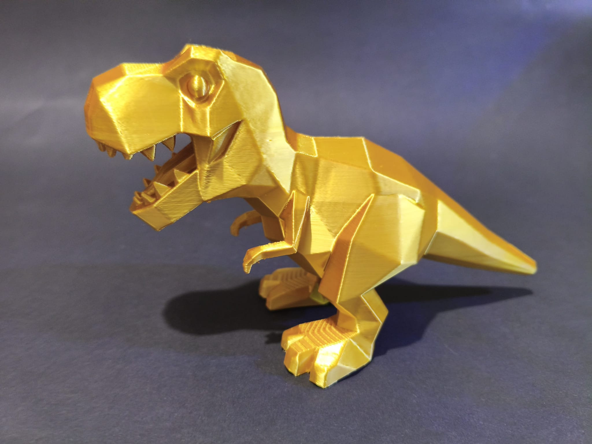 Geometric Golden Low-Poly T-Rex Statue