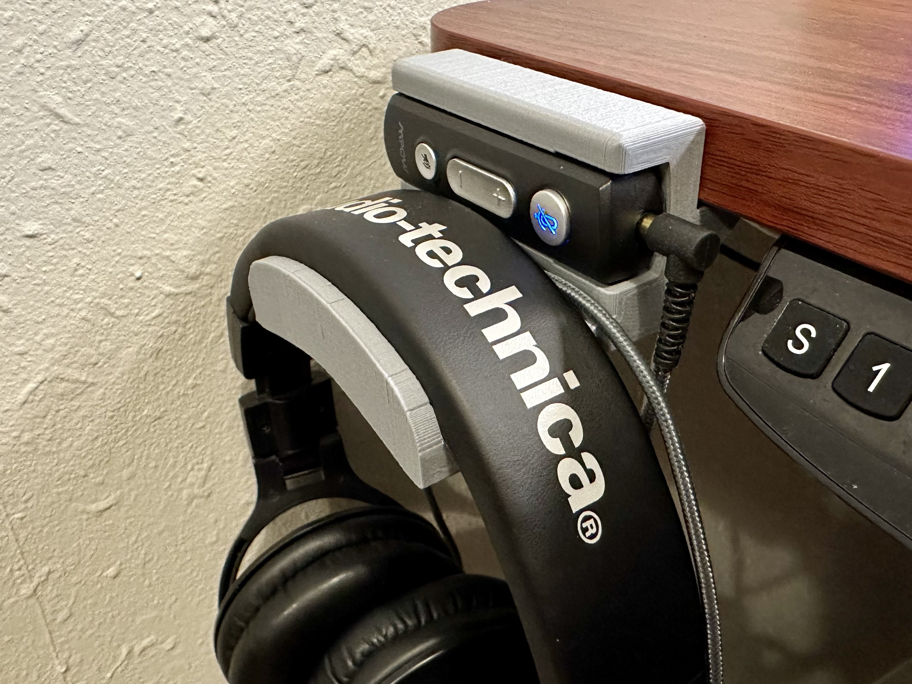 Headphone hanger with added remote cutout