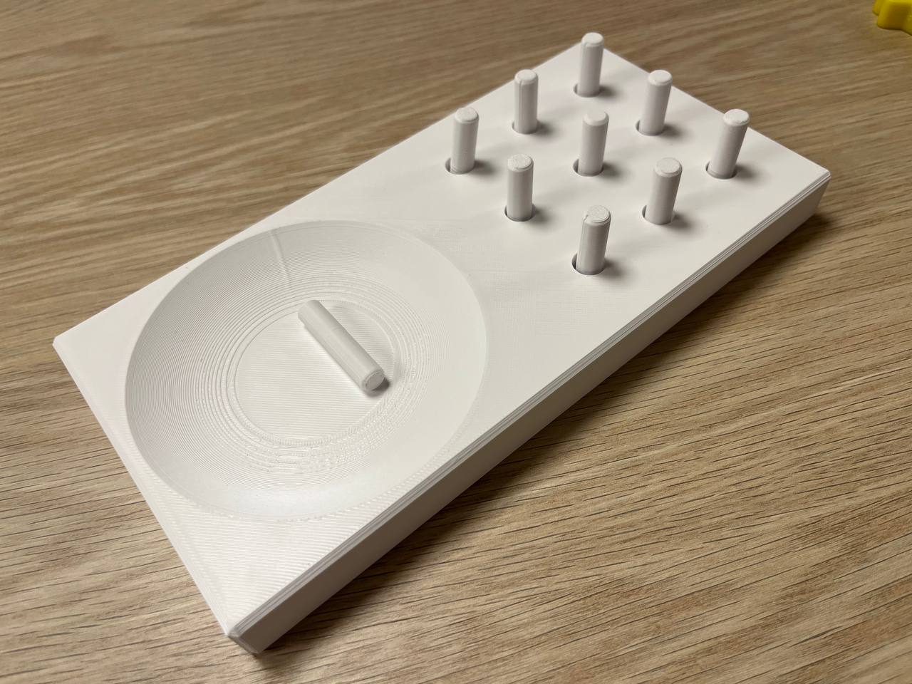 Platform with pegs and a cup 3D model