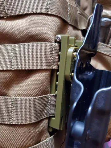 Mussy Molle clips to Vedder holster