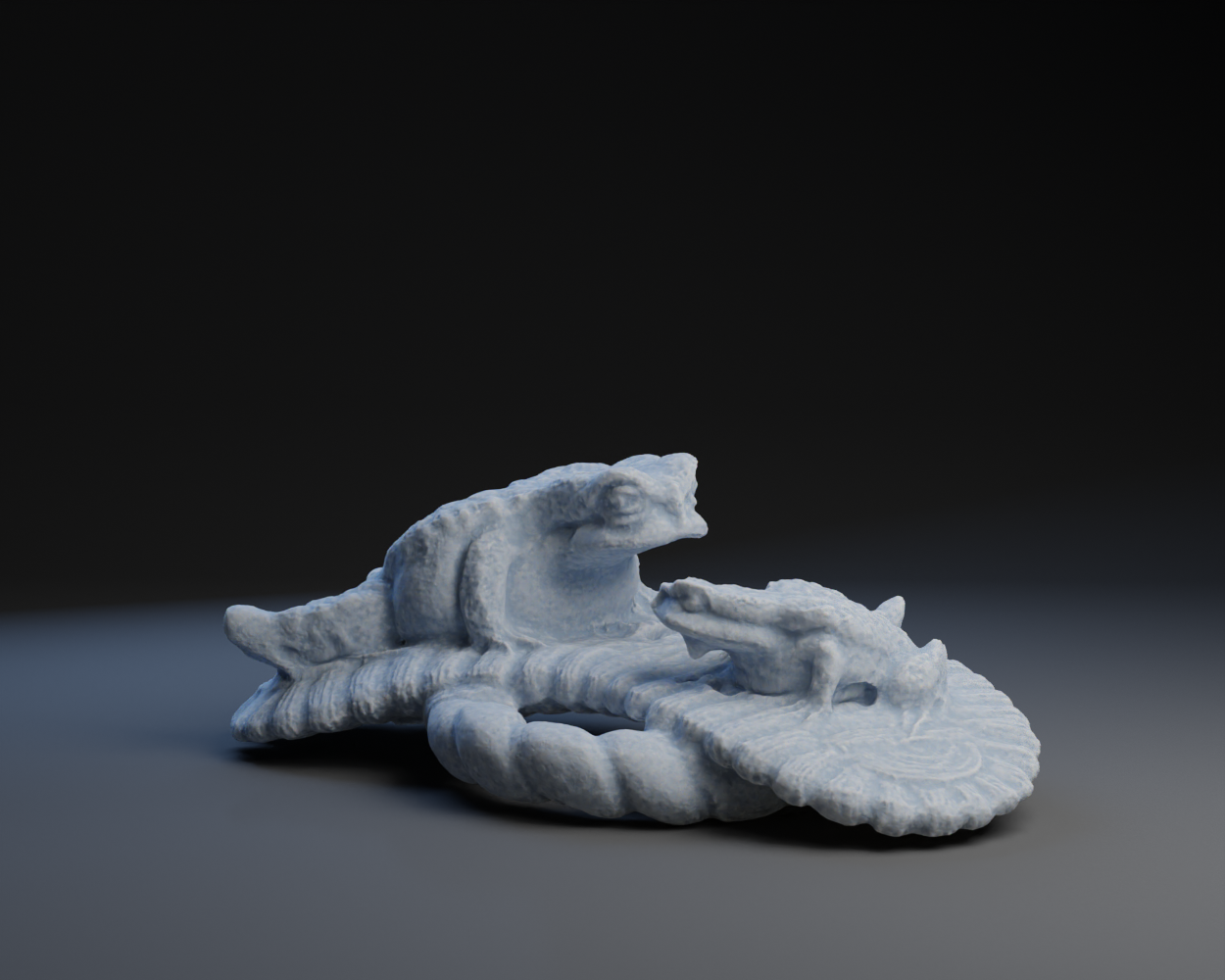 Two Toads on a Floating Sandle Netsuke.