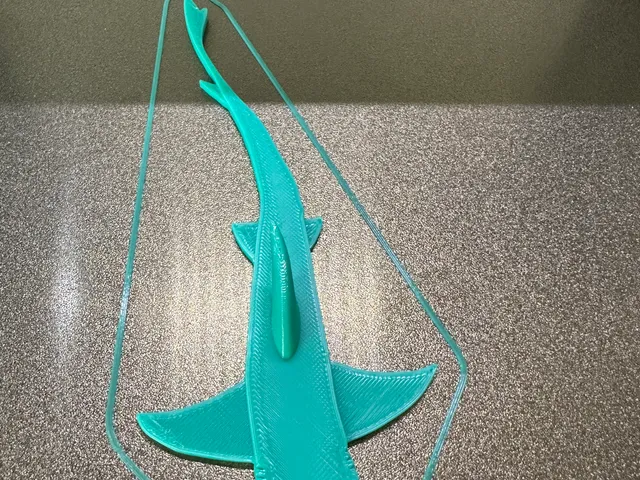 Shark hooks for adhesive attachment