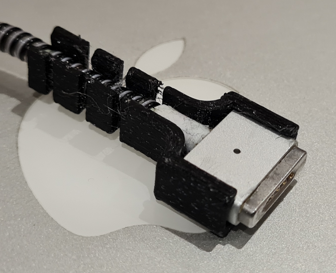MagSafe cable strain relief by Gabriele Cannizzaro Download free STL