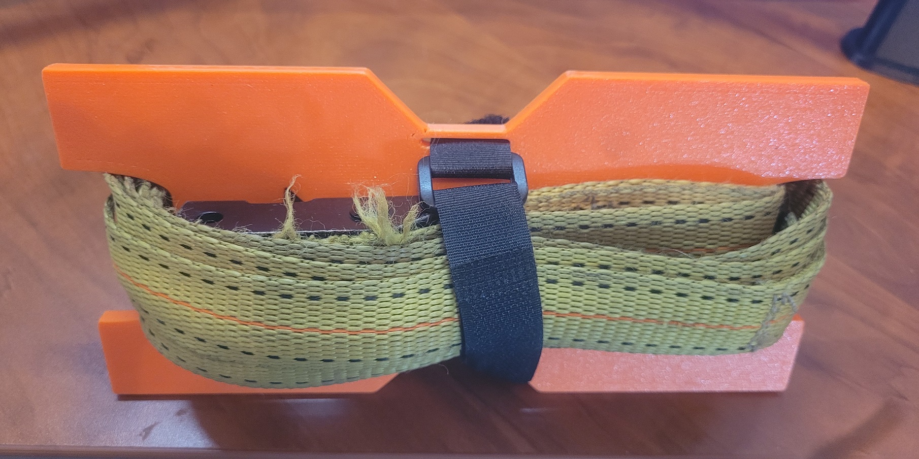 Tie down strap holder