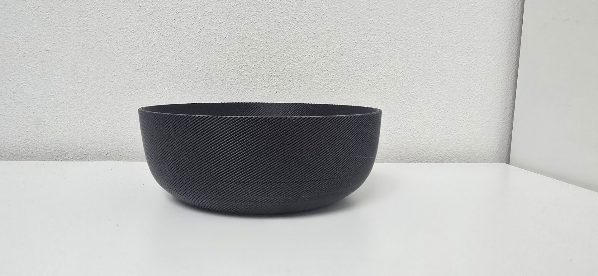 Sleek Black Ribbed Decorative Bowl