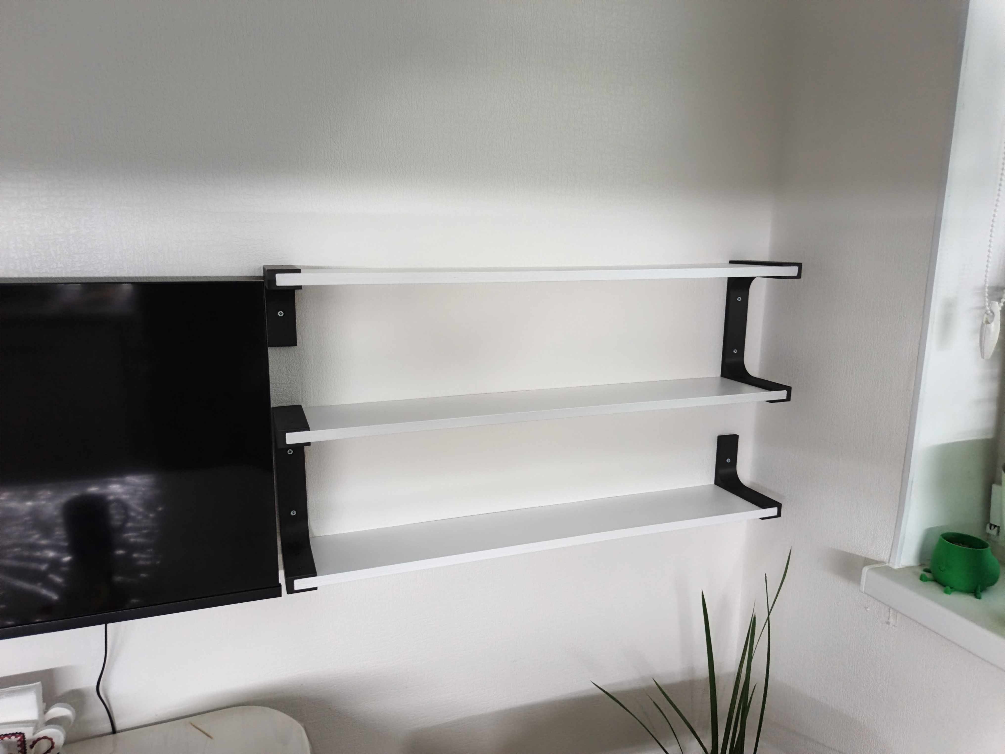 Wall bracket for shelves