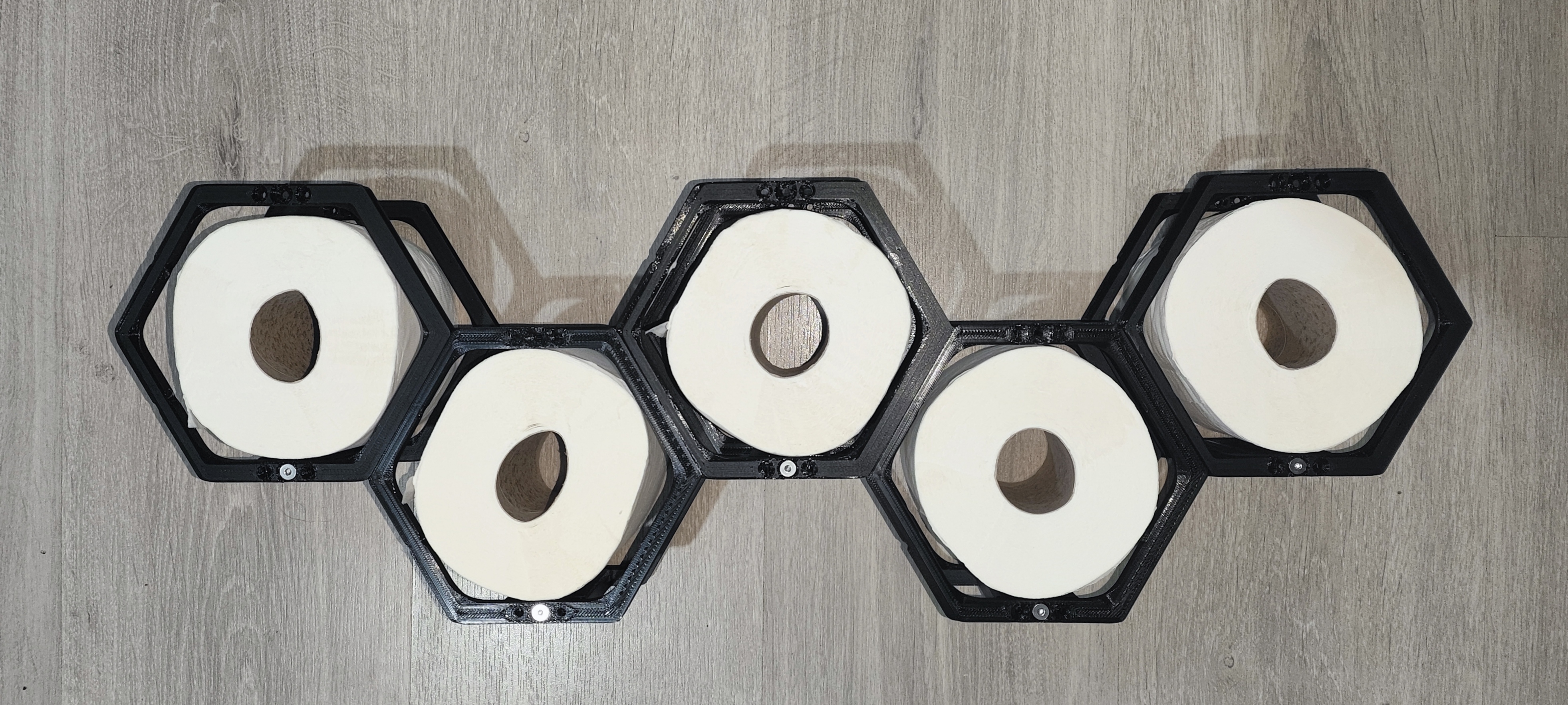 Modular hexagonal wall mount toilet paper holder