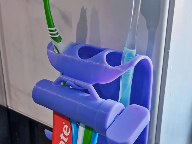 Toothpaste squeezer and toothbrush holder