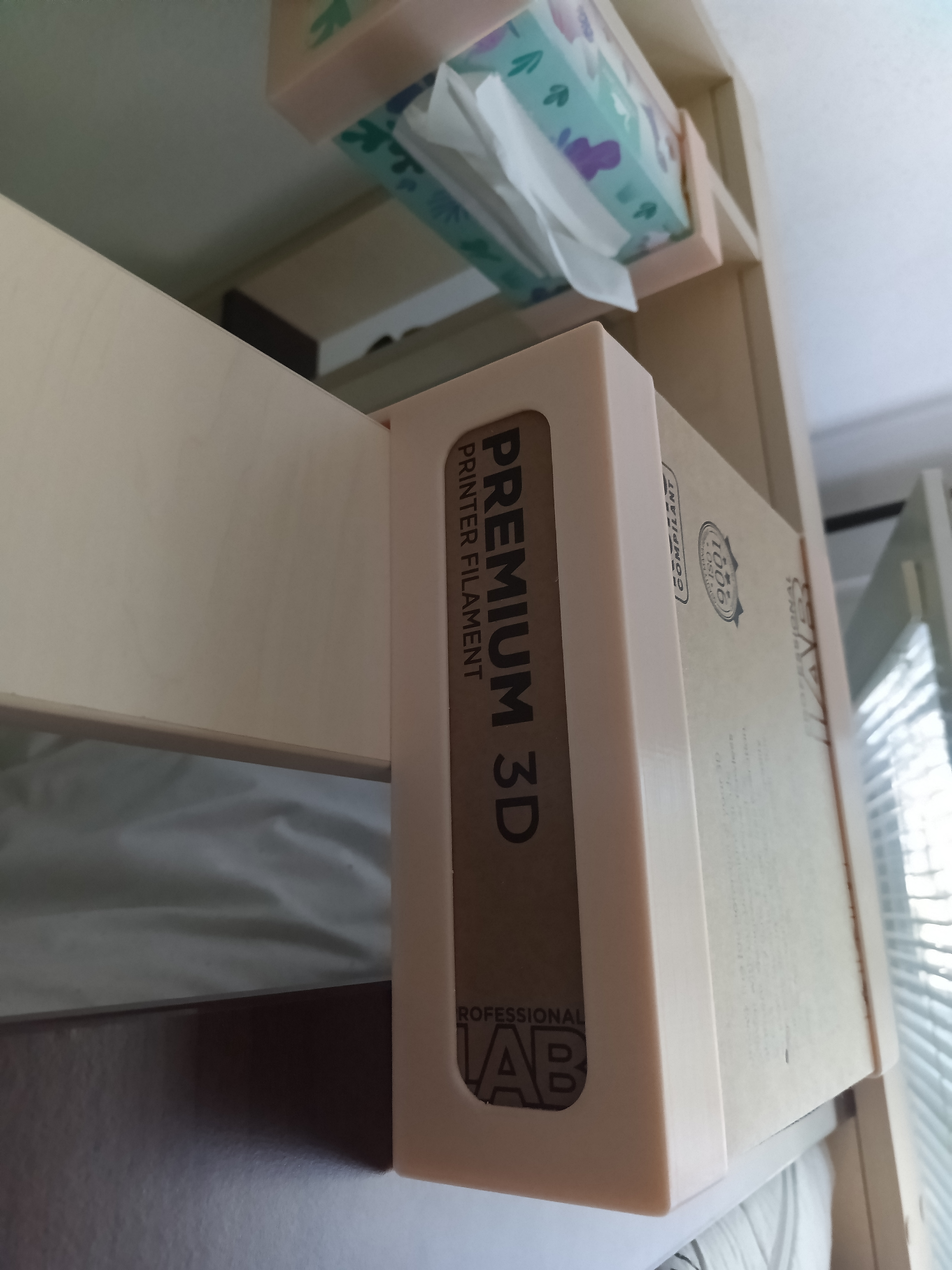 Holder for cardboard filament box