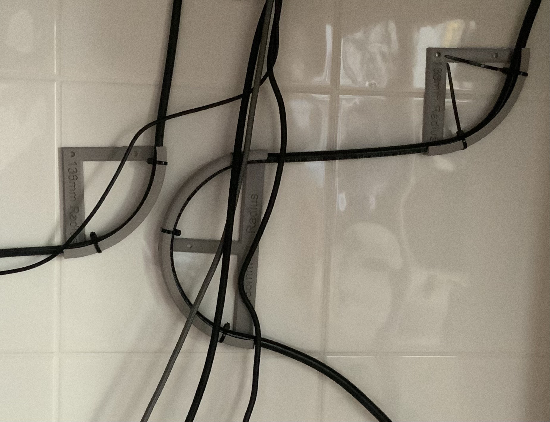 Cable radius enforcer for 7.3mm and 10.3mm coax cable.
