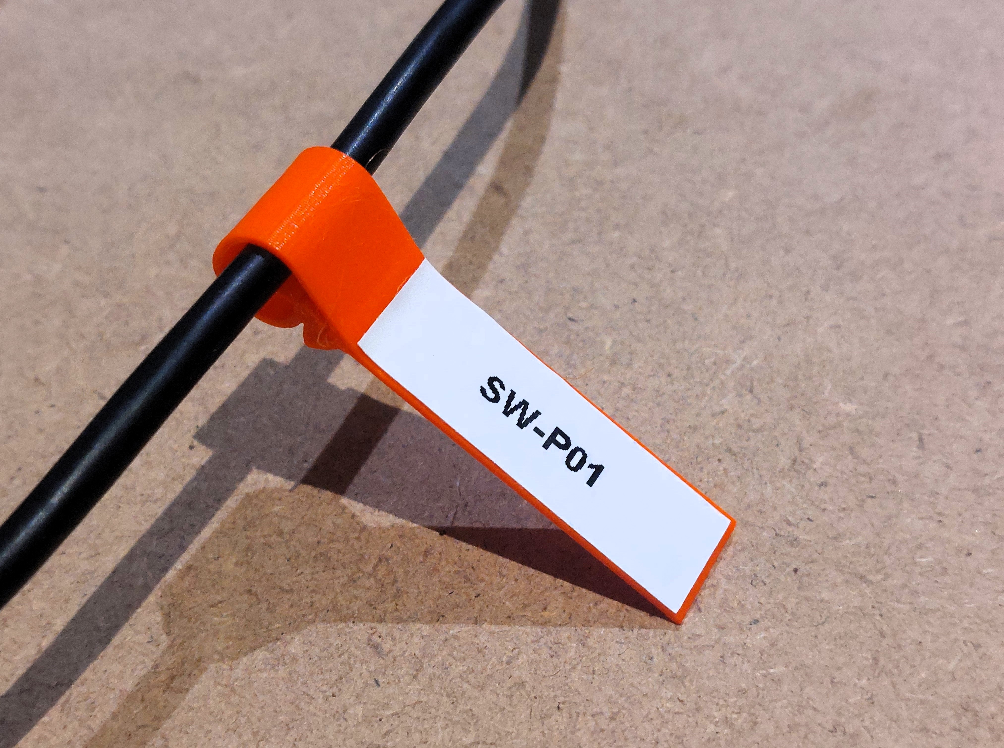 Versatile labeling cable clip. Flag style.