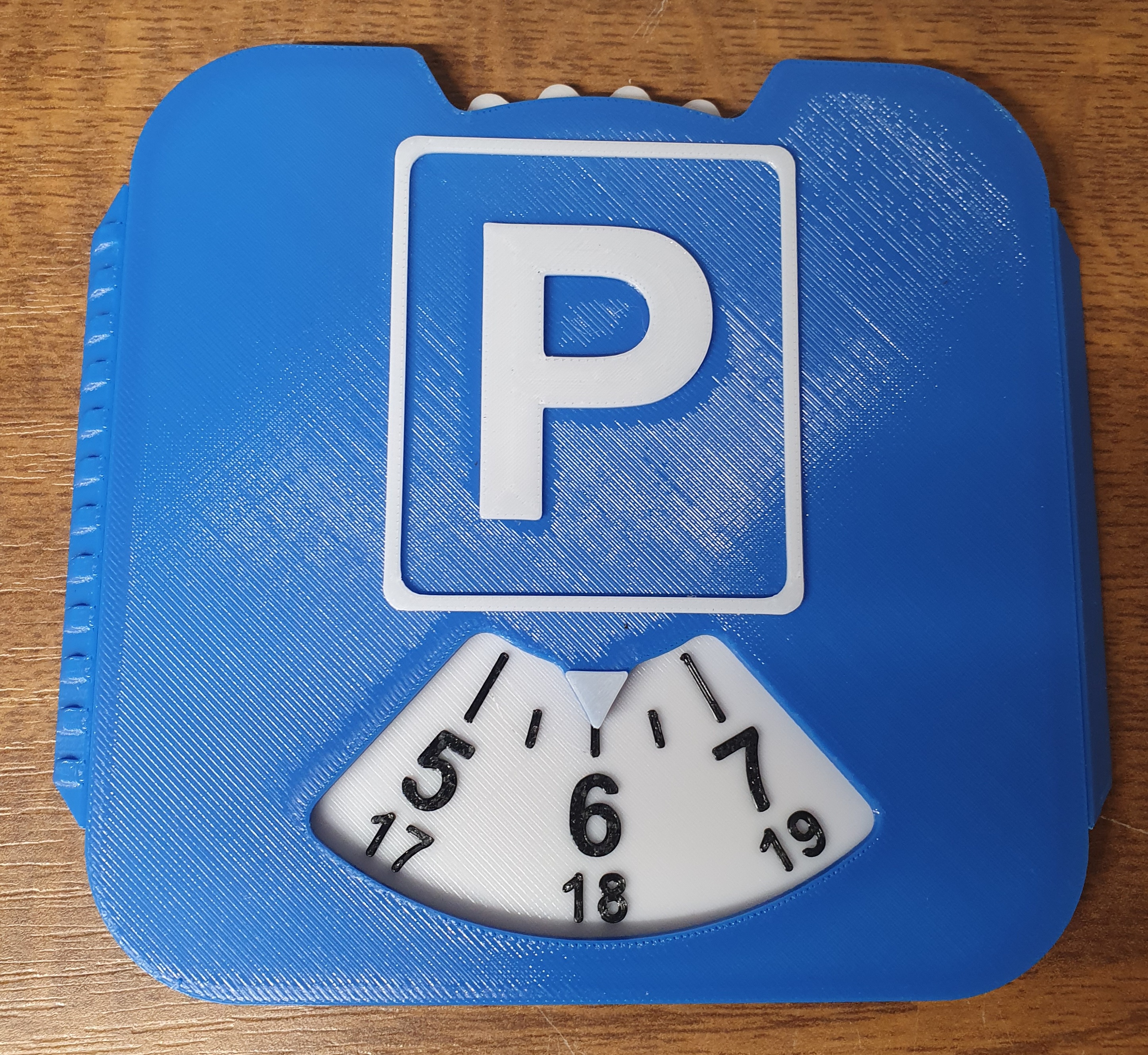 Parking disc with ice scraper