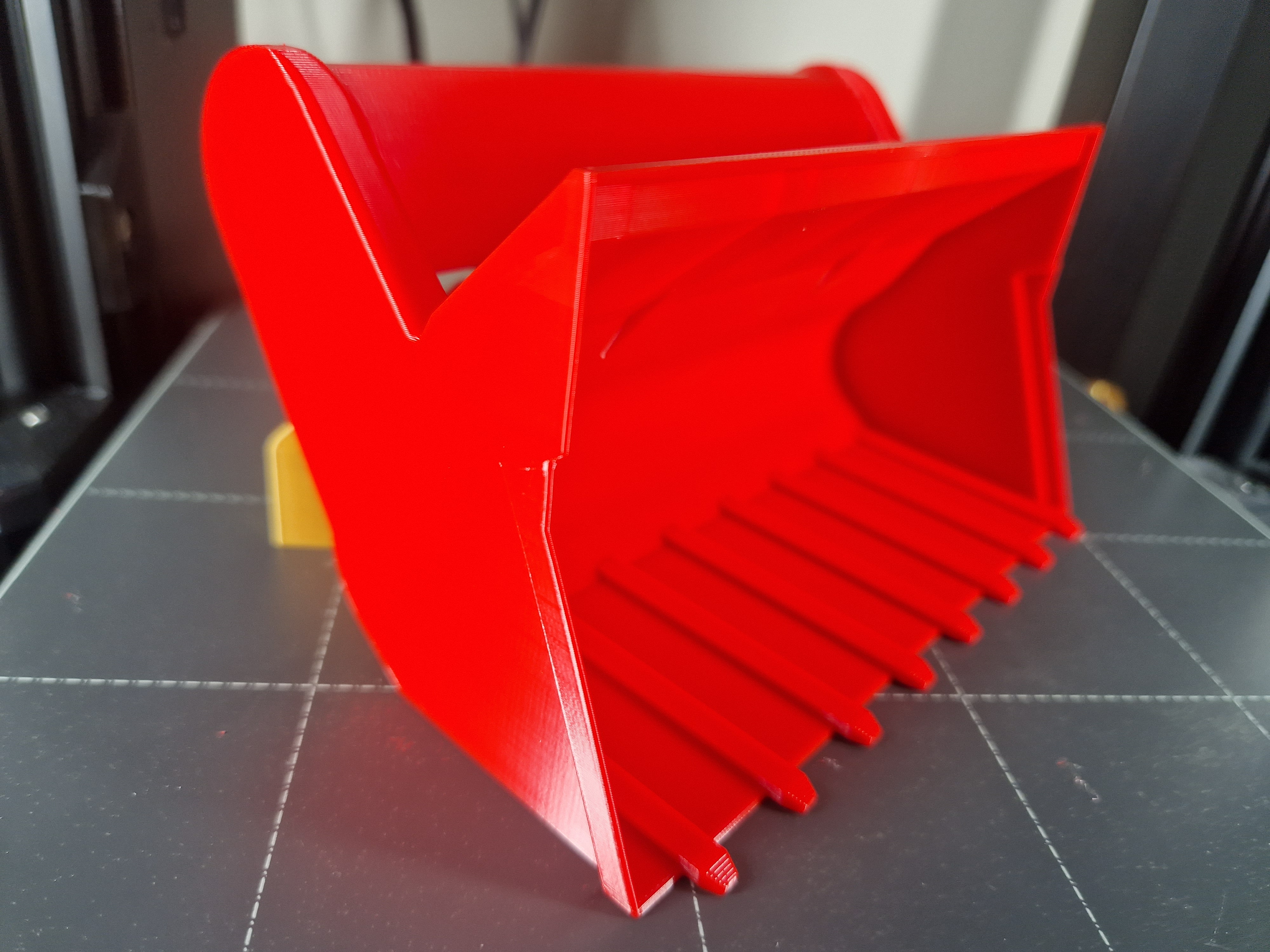 The Windshield De-icing Scraper: Power and Efficiency Inspired by a Backhoe Shovel!