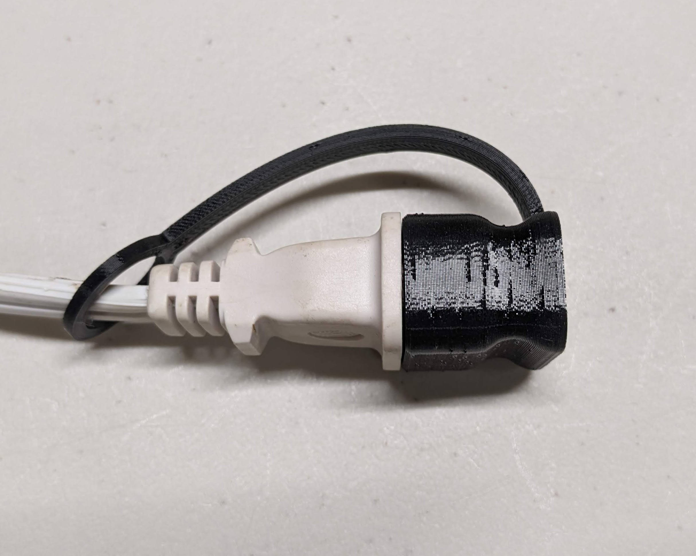 Electrical plug covertethered by Grant Download free STL model