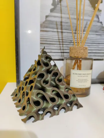 Triply periodic minimal surface pyramids