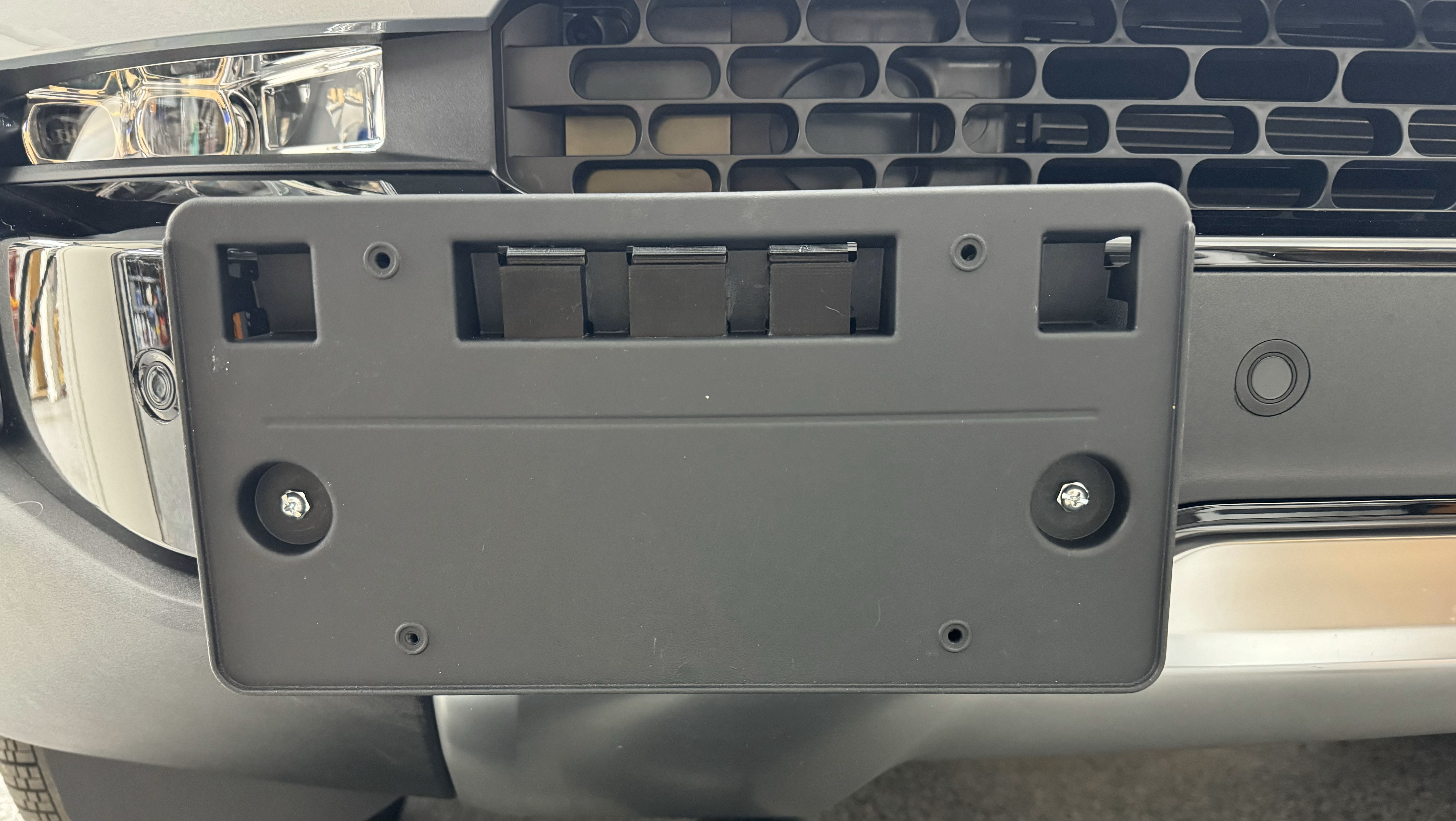 Rivian Tow Hook License plate bracket for OEM plate holder by dradam, Download free STL model
