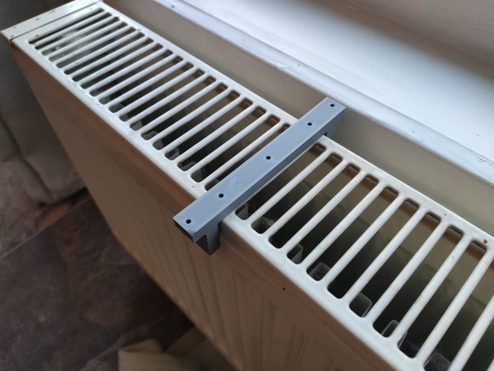 Radiator windowsill mount
