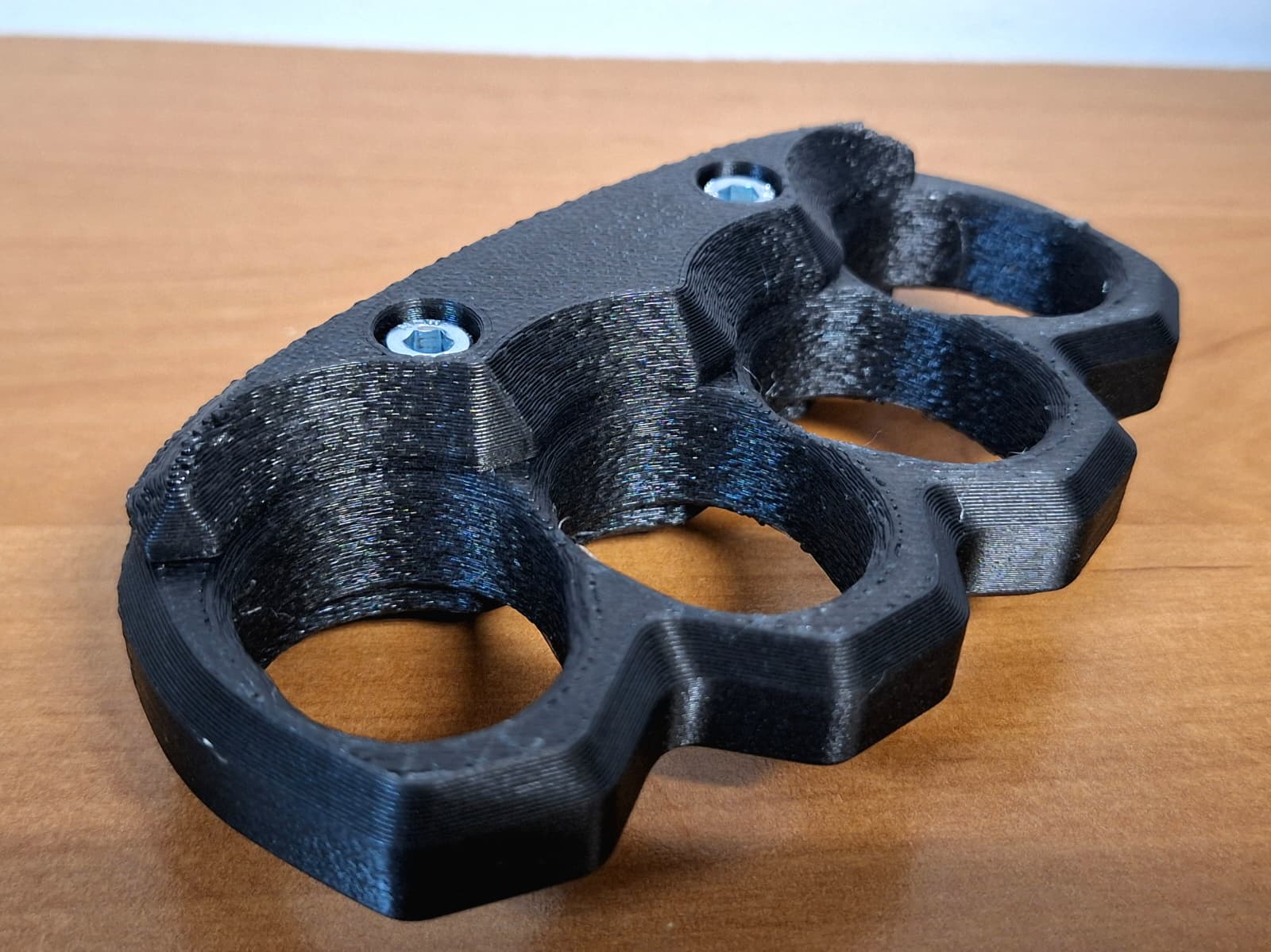 Brass knuckle, very durable.   For cracking nuts!