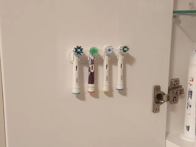 Oral-B toothbrush head holder (1-6 heads; wall/cabinet door mount)