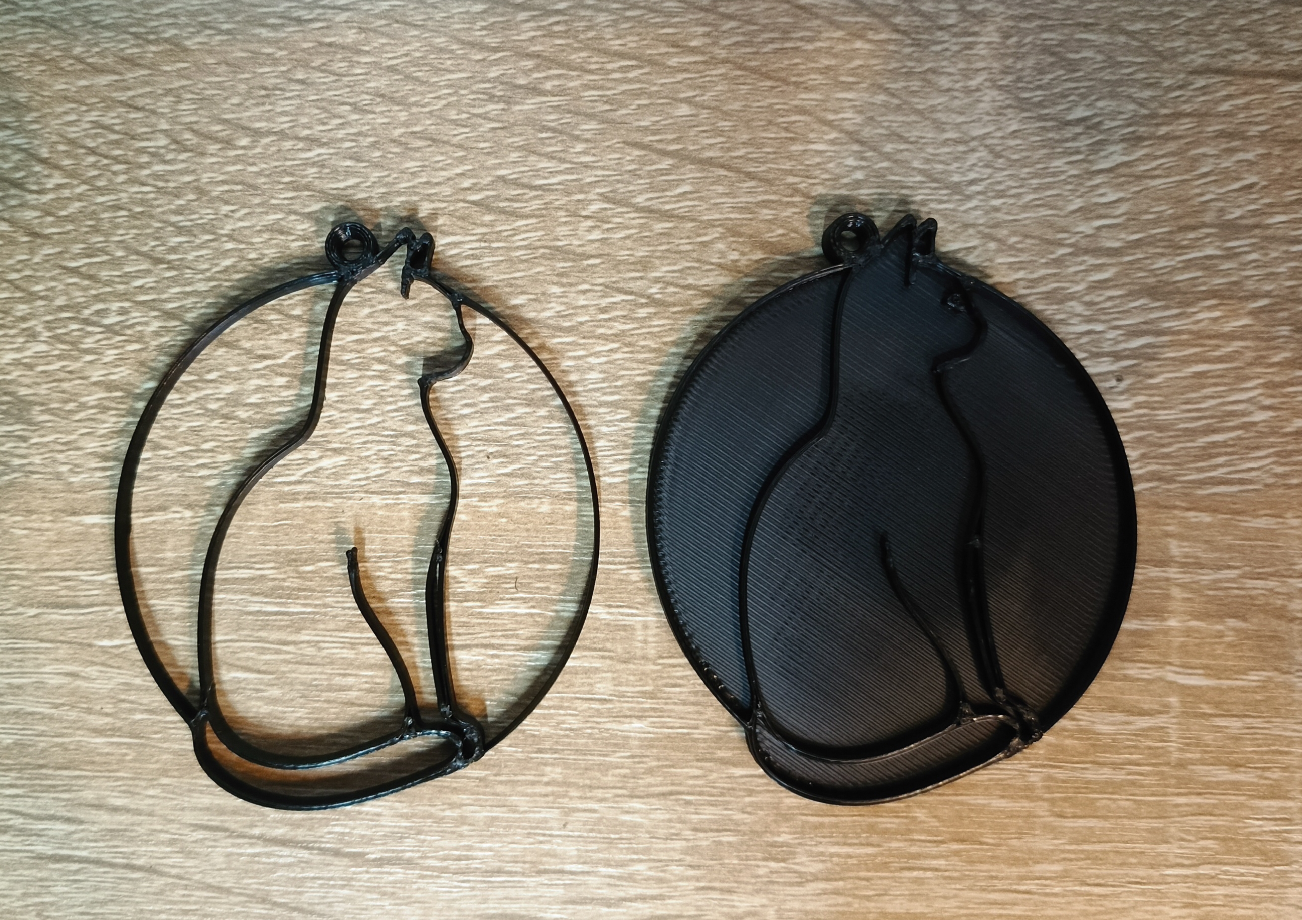 pendant of a cat in a circle