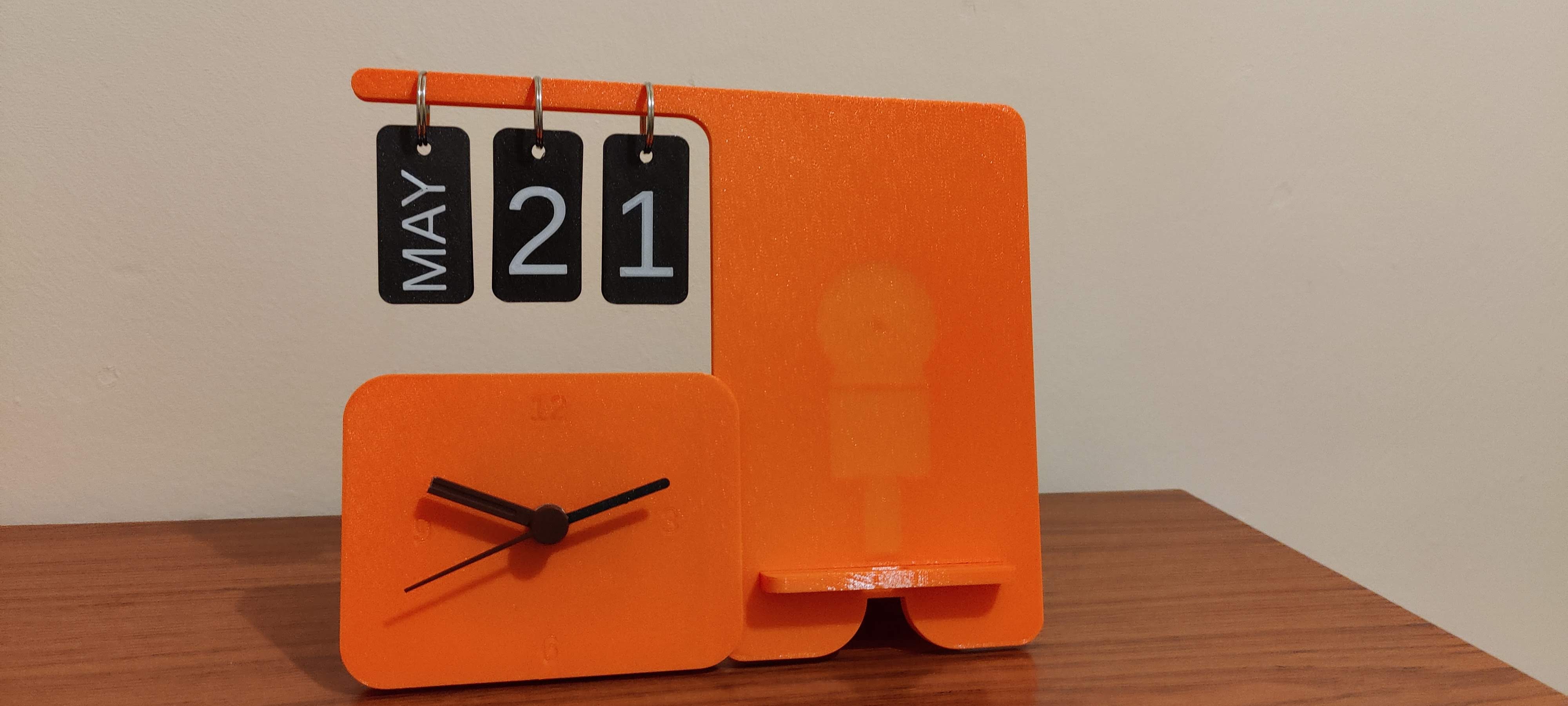 Customizable clock calendar with phone stand.