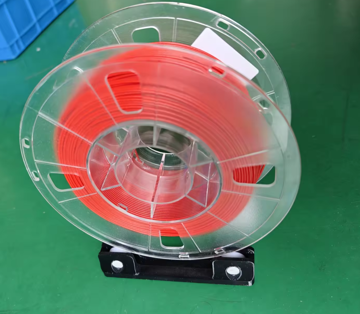 Low resistance low profile filament spool roller base