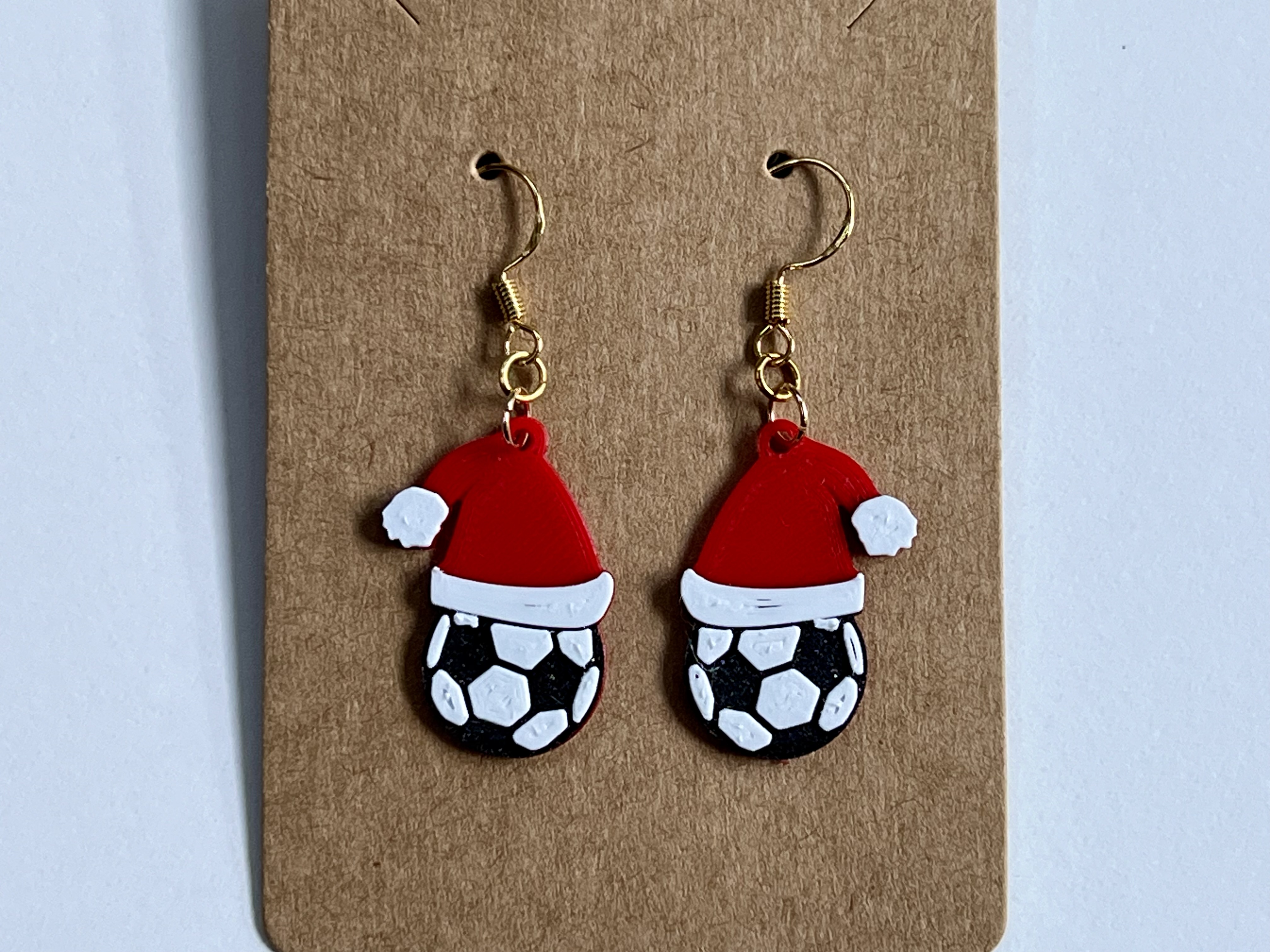 Christmas Earrings with Soccer Ball Wearing a Santa Hat