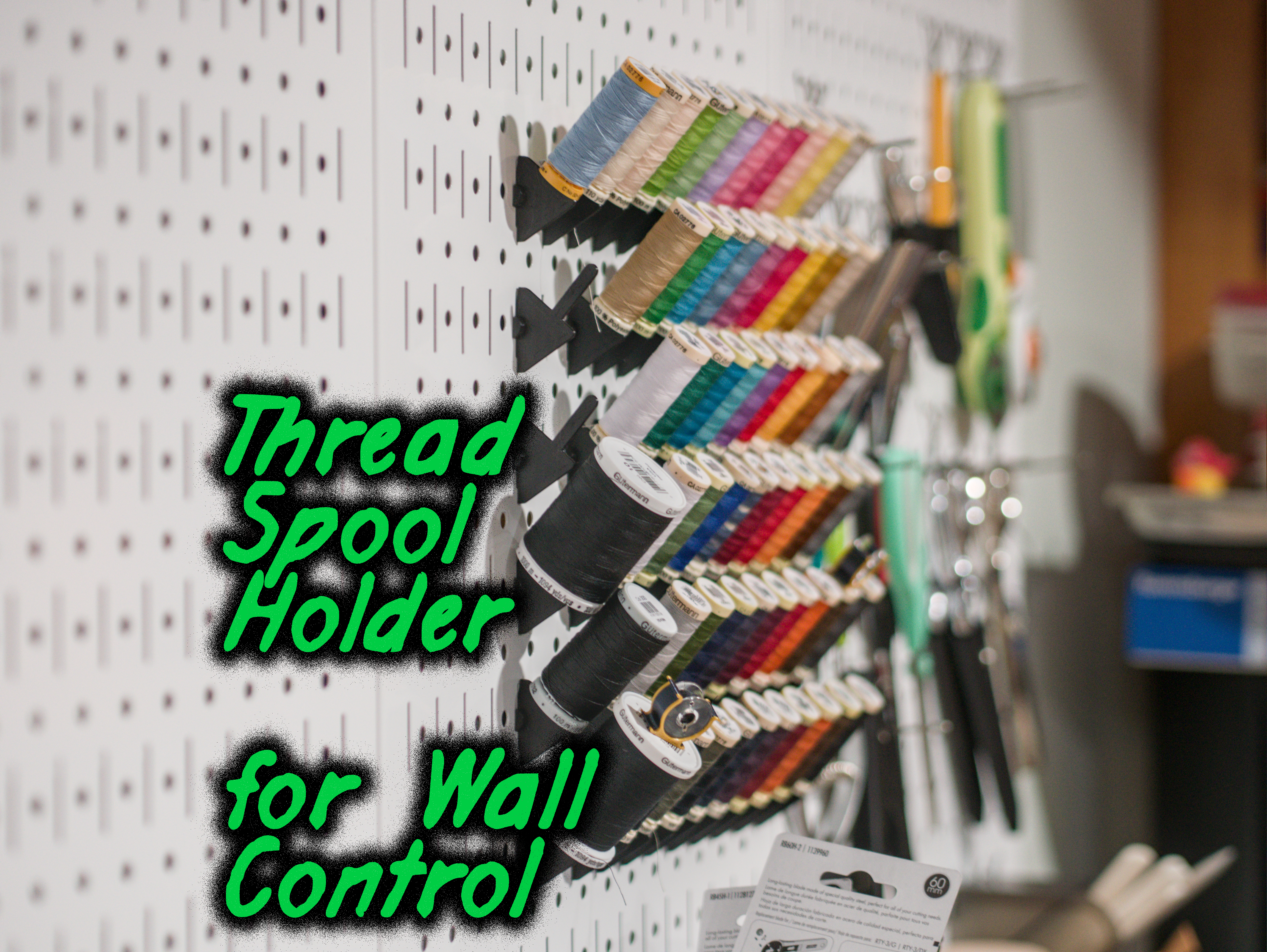 Thread spool mount for Wall Control pegboard system