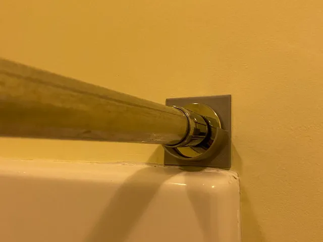 Shower rod retainer