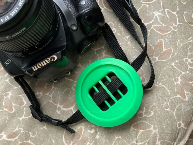 Dual lens cap holder. (58 and 67 mm caps)